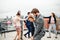 A group of joyful businesspeople having a party outdoors on roof terrace in city, dancing.