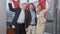 Group of joyful happy business people posing with Canadian flag in office. Cheerful men and woman holding national