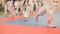 Group of karate sportsmen teenagers in kimono runs on tatami in the gym