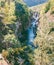 A group of kayakers in a granite canyon of a mountain river