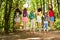 Group of kids with backpacks in nature