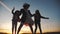 Group of kids dancing in the park silhouette at sunset. kid dream party concept. children dancing in nature at sunset