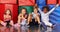 Group of kids in gym holding thumbs up