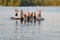 Group of kids jumping into Lake