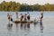 Group of kids jumping into Lake