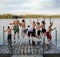 Group of kids jumping into Lake