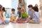 Group of kids learning time with clock toy