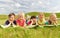 Group of kids lying on blanket or cover outdoors