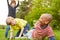 Group of kids is playing and jogging together in the park