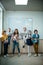 group of kids posing together with laptop and robots on stem