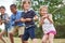 Group of kids pulling a rope