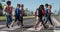 Group of kids with school bags crossing the road