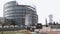 Group of kids tourists next to cherry blossom sakura tree European Parliament