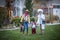 Group of Kids Trick or Treating on Halloween in a decorated neighborhood