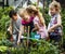 Group of kindergarten kids learning gardening outdoors