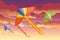 Group of kite soars in the sky flying colored toy vector illustration with cloudy evening sky on background