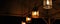 Group of lamps in mesh metal shades against the background of rough wooden ceiling. Blurred loft interior