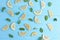 Group lemon cut slices with mints leaf freshness on blue wooden background