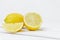 Group of lemons: whole, half and a slice on a white background. Space for text. Vitamins and a healthy diet