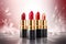 a group of lipsticks sitting on top of a table next to a red and white background and a red and white background behind them