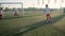 Group of little football players is playing soccer, scoring goal