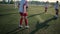 Group of little footballers training on field