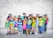 Group of Little students Standing Close to the Wall