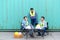 Group of logistic staff workers talk and rest sitting in the shipping yard container during break time. Cargo ship import export