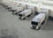 Group of logistic trailer trucks or lorries at warehouse