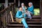 A group of malay muslim people in traditional costume having happy conversation during Aidilfitri celebration at terrace of