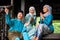 A group of malay muslim people in traditional costume having happy conversation during Aidilfitri celebration at terrace of