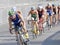 Group of male cycling triathlon competitors fighting