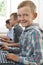 Group Of Male Elementary School Children In Computer Class