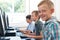 Group Of Male Elementary School Children In Computer Class