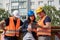 Group of male and female workers on construction site