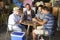 Group Of Male Friends Playing Cards In Garage