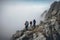 A group of male hikers with backpacks climb a rocky hill.