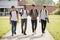 Group Of Male Teenage Students Walking Around College Campus