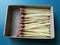 Group of matches in small cardboard box