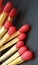 A group of matchsticks over black background.