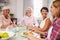 Group Of Mature Female Friends Enjoying Meal At Home