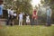 Group Of Mature Friends Playing Croquet In Backyard Together