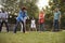 Group Of Mature Friends Playing Croquet In Backyard Together