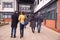 Group Of Mature Students Arriving Outside College Building