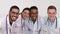 A group of medical students smiling in a hospital, doctors of mixed race
