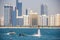 Group of men doing water sports in front of skyline taken on March 31, 2013 in Abu Dhabi, United Arab