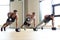 Group of men with dumbbells in gym