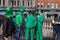 Group of men in green clothes and Irish hats on O`Connell Street in Dublin, Ireland on St. Patrick`s Day