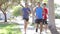 Group Of Men Jogging Down Urban Street