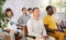 Group of men listening to lecture in auditorium attentively